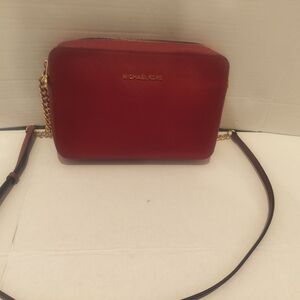 Michael Kors Burgundy Red Crossbody Bag, With Gold Lettering And Gold Accessorie
